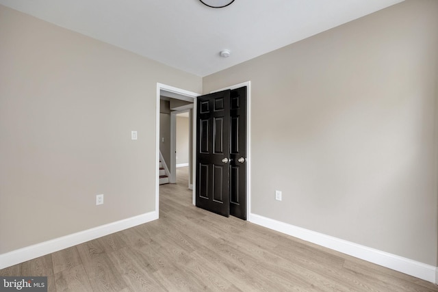 unfurnished bedroom with light hardwood / wood-style flooring