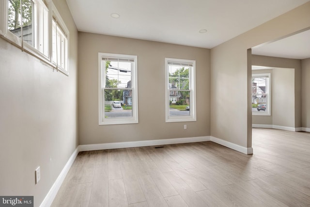 spare room with light hardwood / wood-style floors