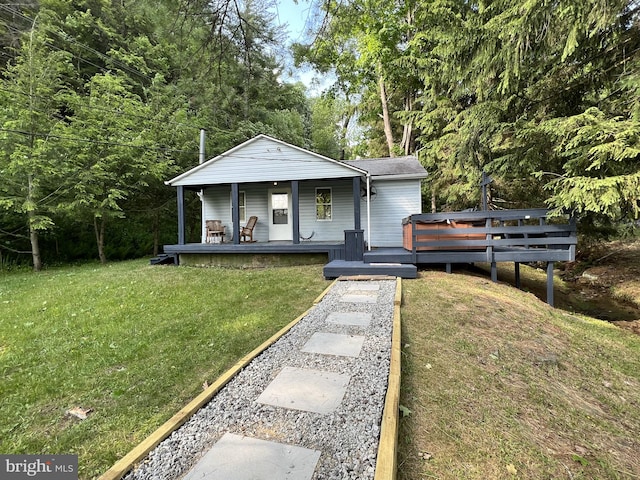 bungalow-style home featuring a front lawn