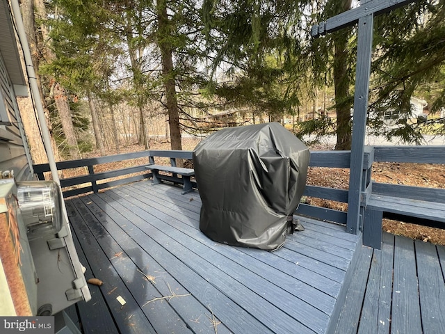 wooden terrace featuring grilling area