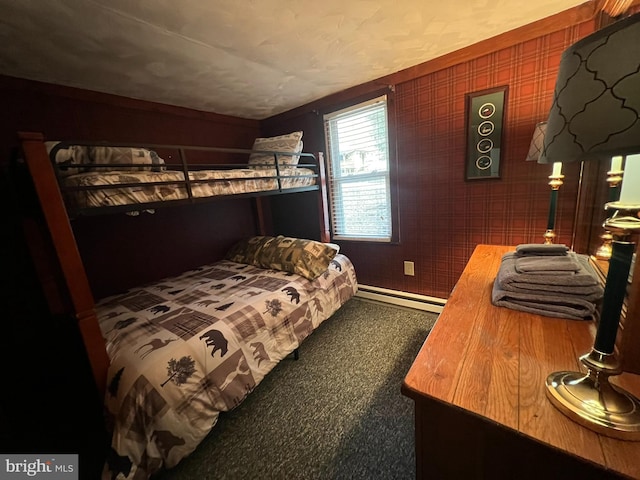 carpeted bedroom featuring a baseboard radiator