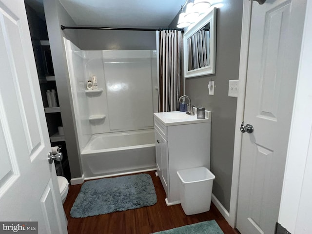 full bathroom featuring shower / bath combo, hardwood / wood-style flooring, toilet, and large vanity