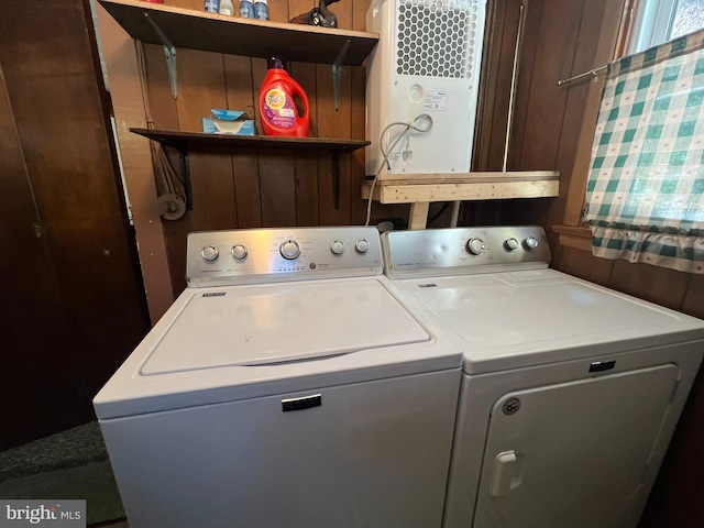 laundry area featuring washing machine and clothes dryer