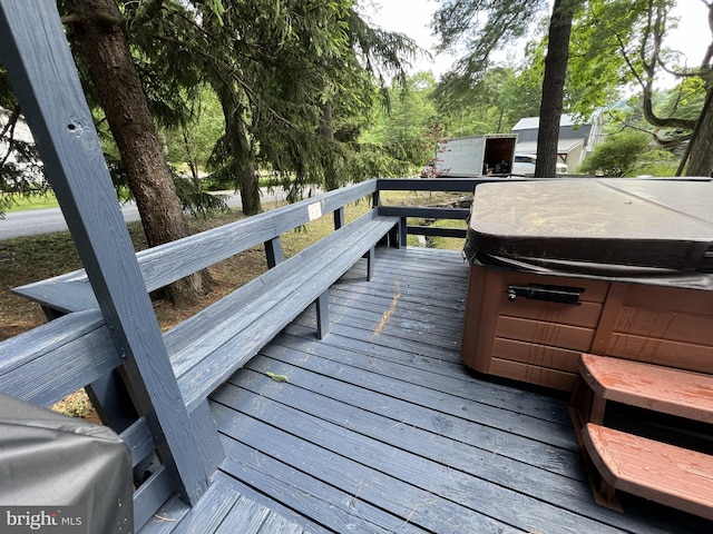 deck featuring a hot tub