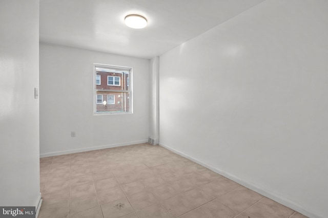 empty room with light tile flooring