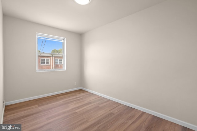 empty room featuring wood-type flooring