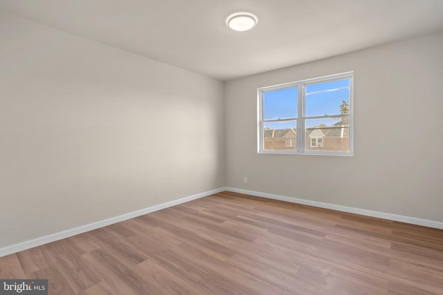 unfurnished room featuring wood-type flooring