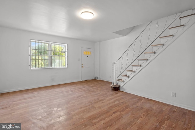 entrance foyer with hardwood / wood-style floors