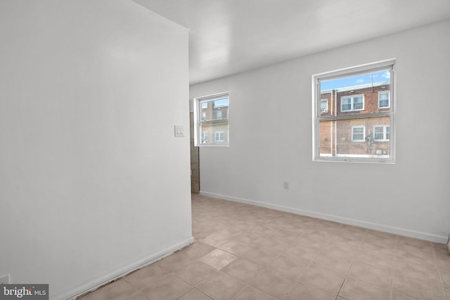 tiled empty room with plenty of natural light