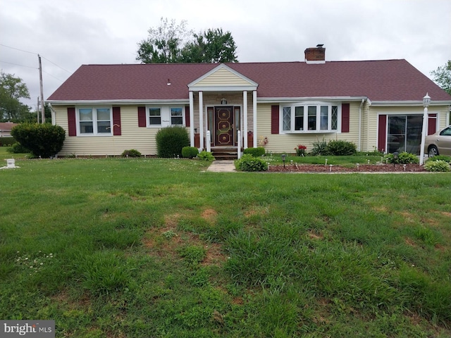 ranch-style house with a front yard