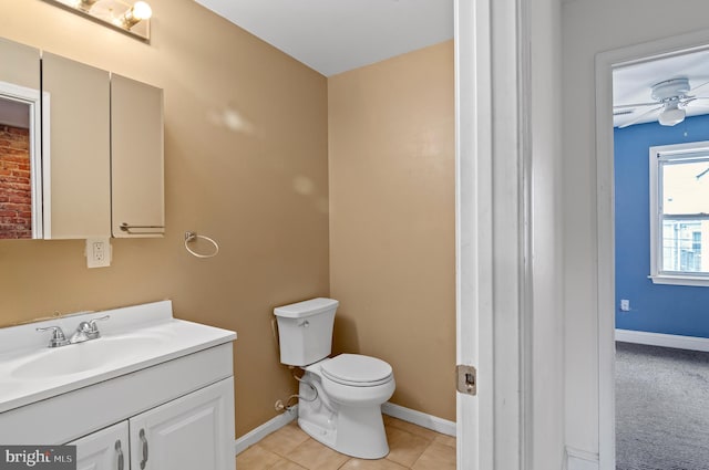 bathroom with ceiling fan, toilet, tile patterned flooring, and vanity