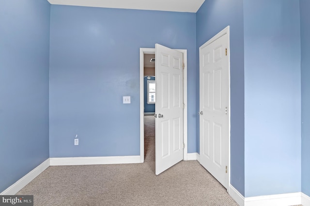 spare room featuring carpet floors