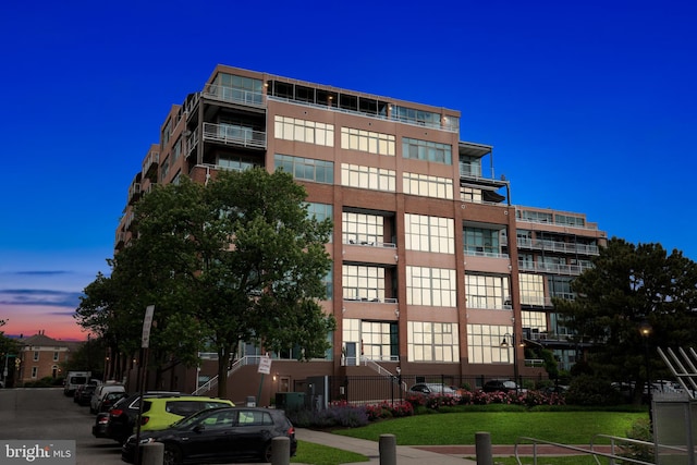 view of outdoor building at dusk