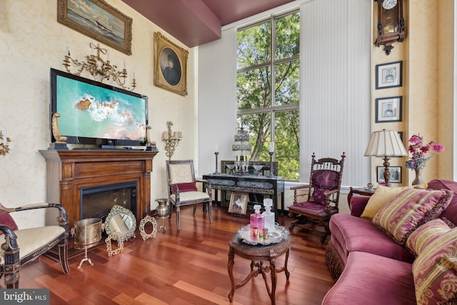 living room with floor to ceiling windows and wood-type flooring