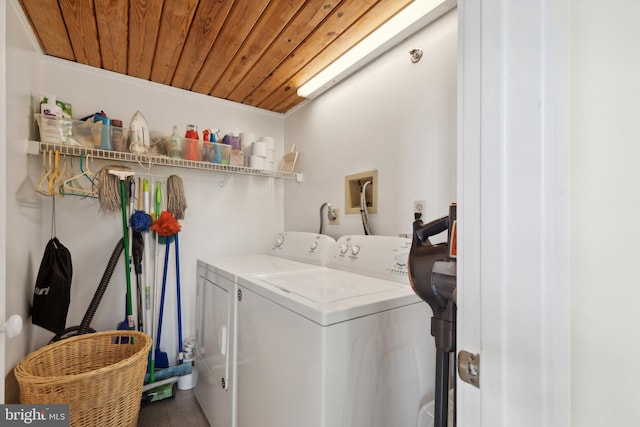 clothes washing area featuring hookup for an electric dryer, washer hookup, wood ceiling, and washing machine and dryer