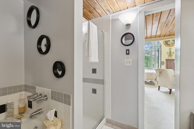 bathroom with a shower with door and wooden ceiling