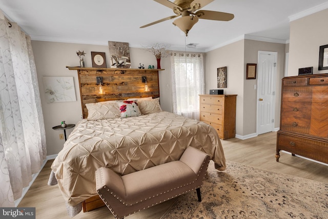 bedroom with ceiling fan, crown molding, and light wood-type flooring