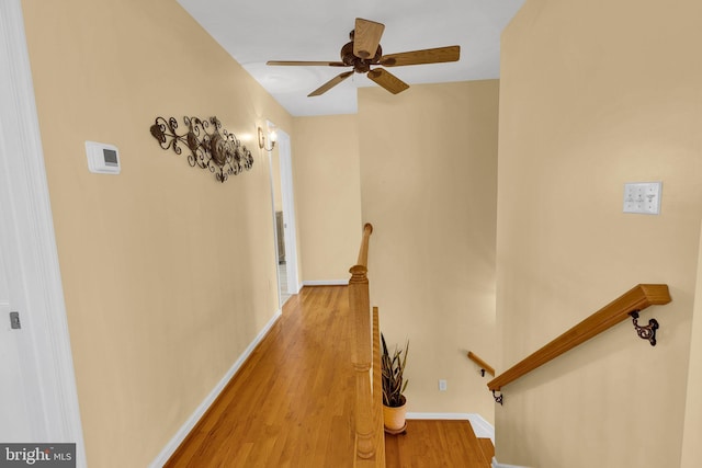 hallway with light hardwood / wood-style floors