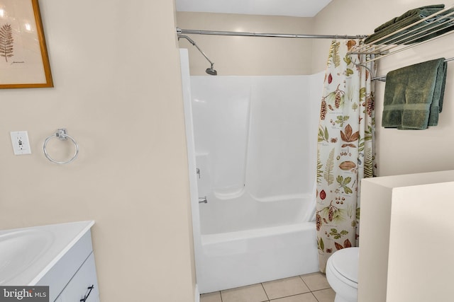 full bathroom featuring toilet, vanity, tile patterned floors, and shower / bath combo with shower curtain