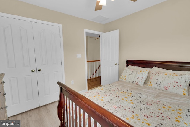 bedroom with ceiling fan, a closet, and light wood-type flooring