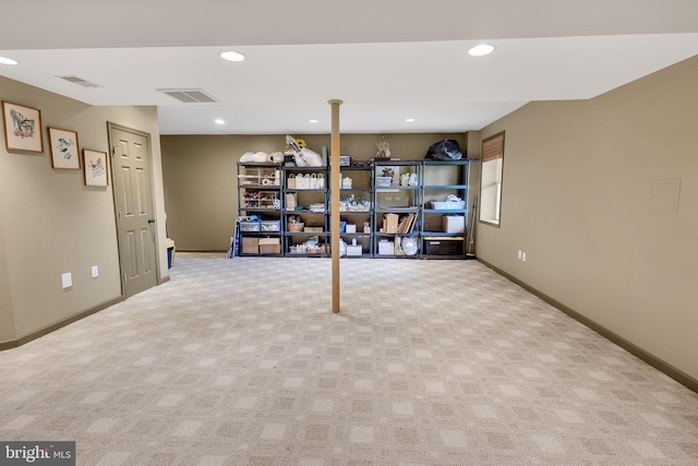 basement featuring light carpet