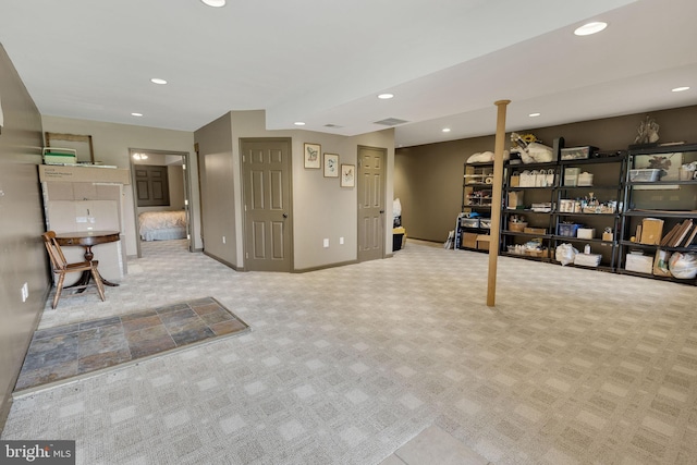 basement featuring light carpet