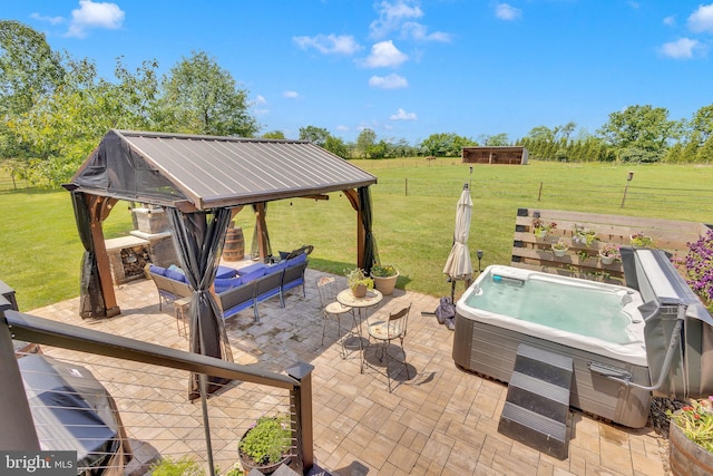 view of patio with a gazebo, an outdoor living space, and a hot tub