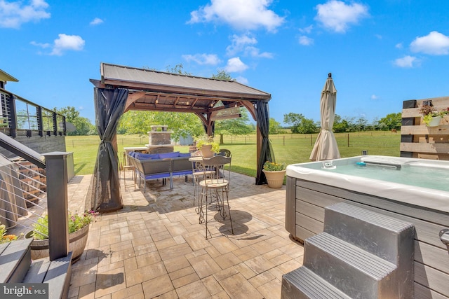 view of patio / terrace with a gazebo and a hot tub