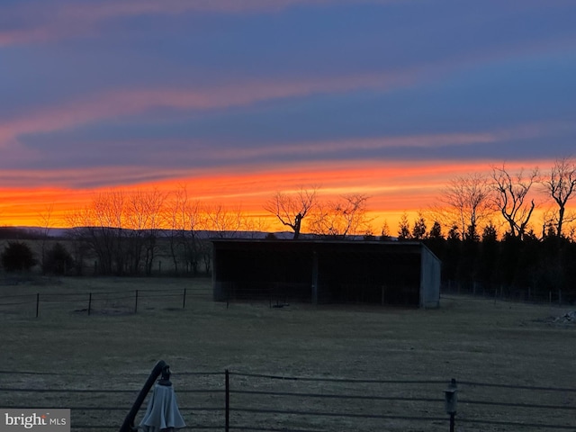 yard at dusk with an outbuilding