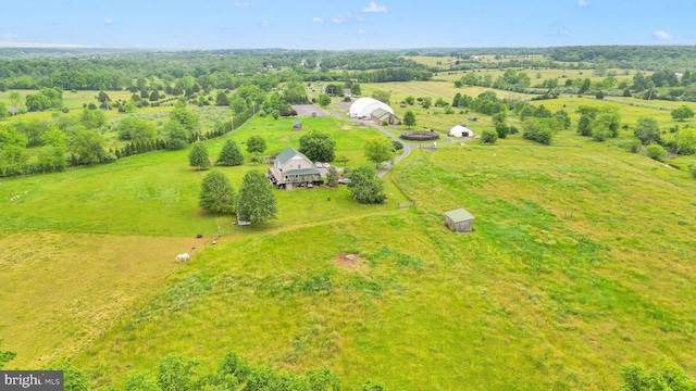 birds eye view of property featuring a rural view