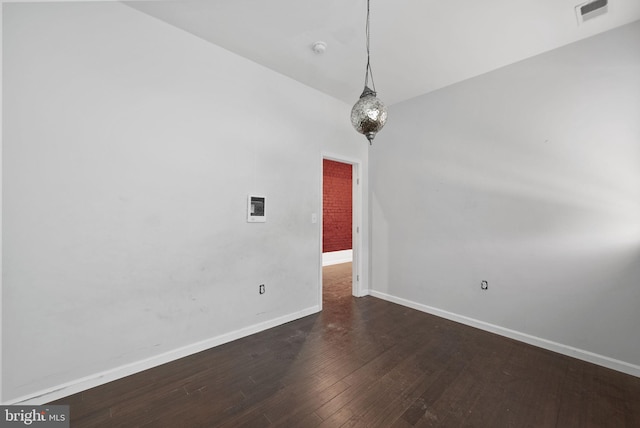 spare room featuring hardwood / wood-style flooring