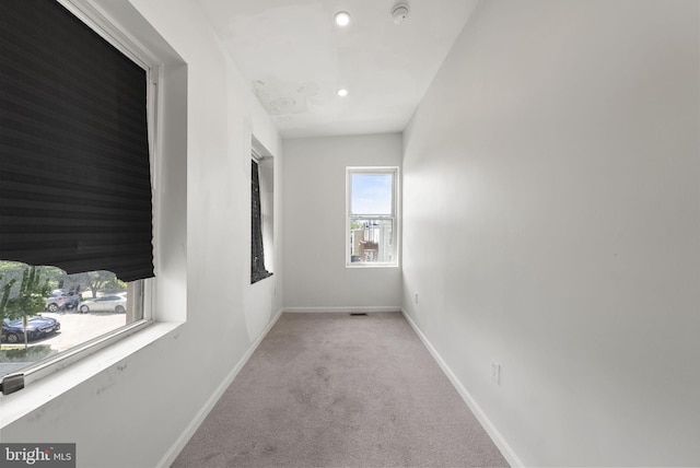 corridor featuring carpet flooring