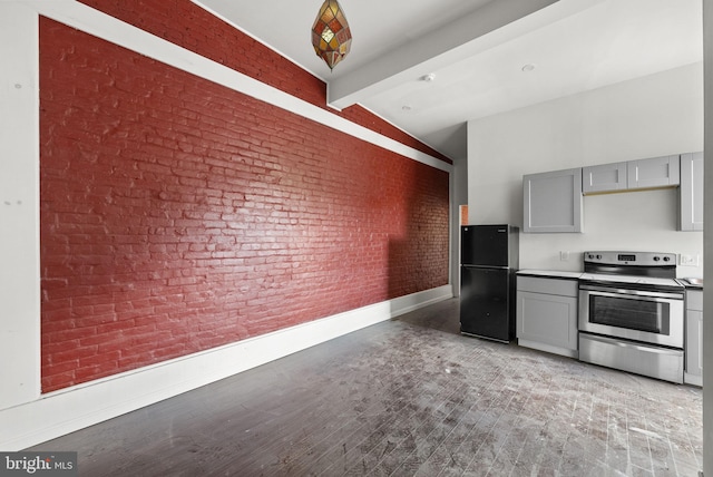 kitchen featuring electric range, gray cabinetry, black refrigerator, and vaulted ceiling with beams