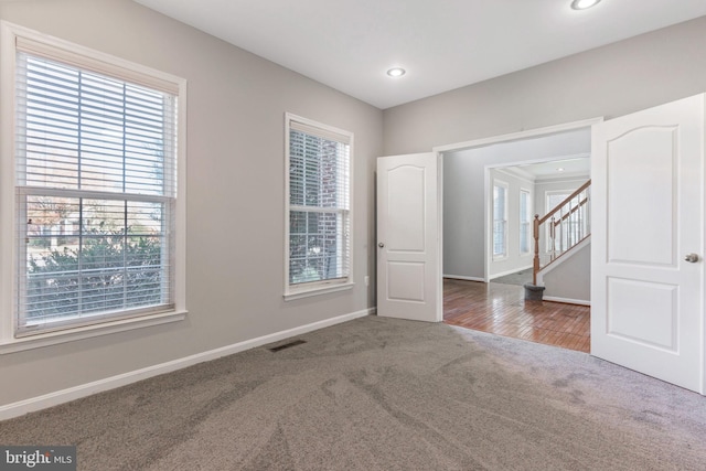 empty room featuring carpet flooring