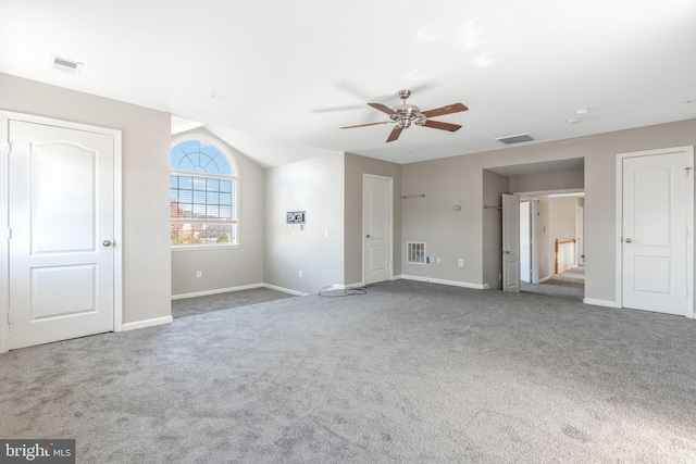 interior space with ceiling fan and carpet floors