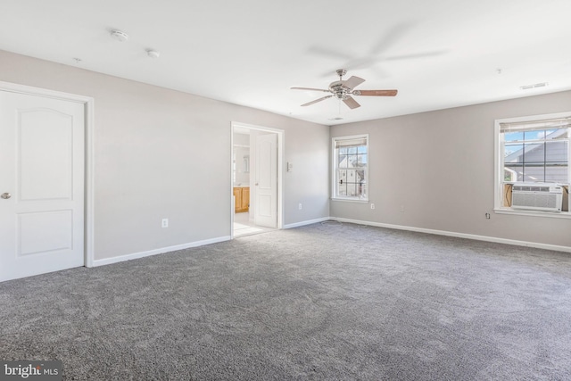 unfurnished bedroom with cooling unit, ceiling fan, light carpet, and multiple windows