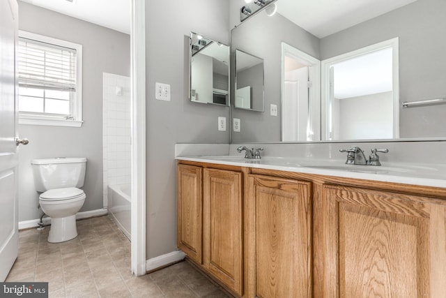 full bathroom featuring vanity, toilet, and washtub / shower combination