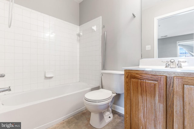 full bathroom with shower / tub combination, vanity, tile patterned floors, and toilet