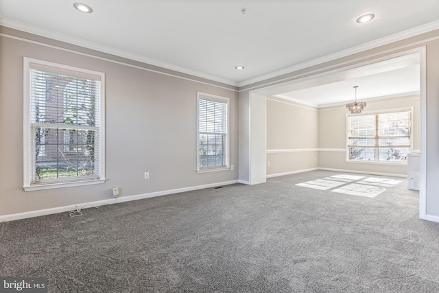 unfurnished room with crown molding, a healthy amount of sunlight, and carpet flooring