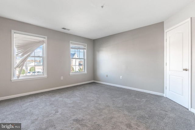 unfurnished room featuring carpet floors