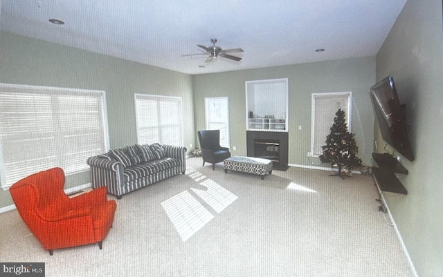 living room with carpet flooring and ceiling fan