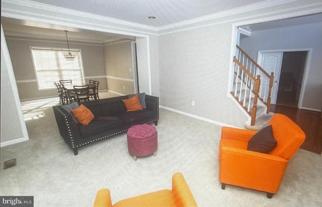 living room featuring carpet floors and ornamental molding