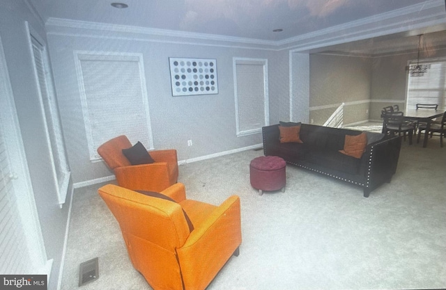 carpeted living room featuring ornamental molding