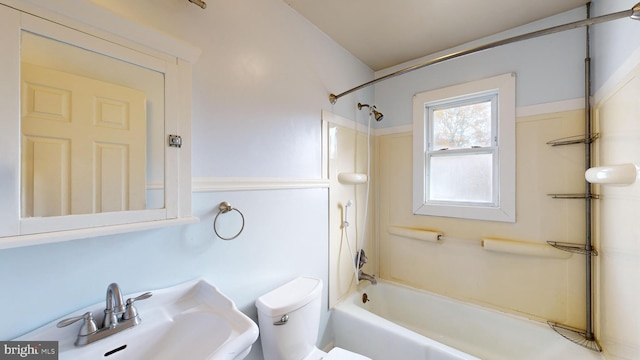 full bathroom featuring shower / washtub combination, sink, and toilet