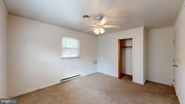 unfurnished bedroom with baseboard heating, carpet floors, ceiling fan, and a closet