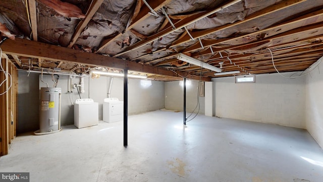 basement featuring separate washer and dryer and water heater