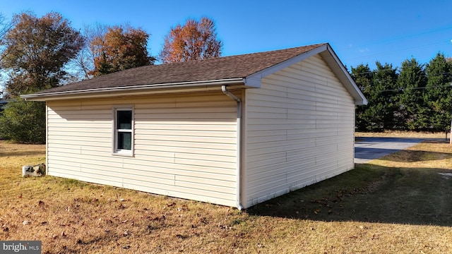 view of outdoor structure featuring a lawn