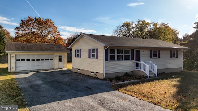 view of front facade with a garage and a front lawn