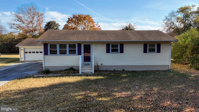 ranch-style home with a garage and a front yard