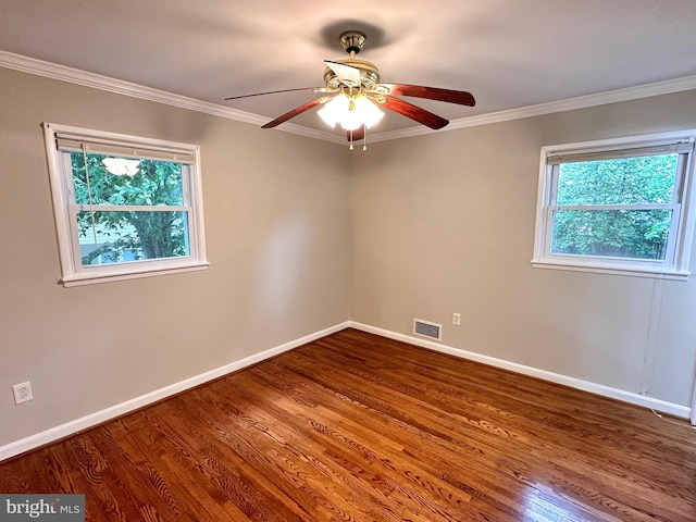 unfurnished room featuring crown molding, hardwood / wood-style floors, and ceiling fan